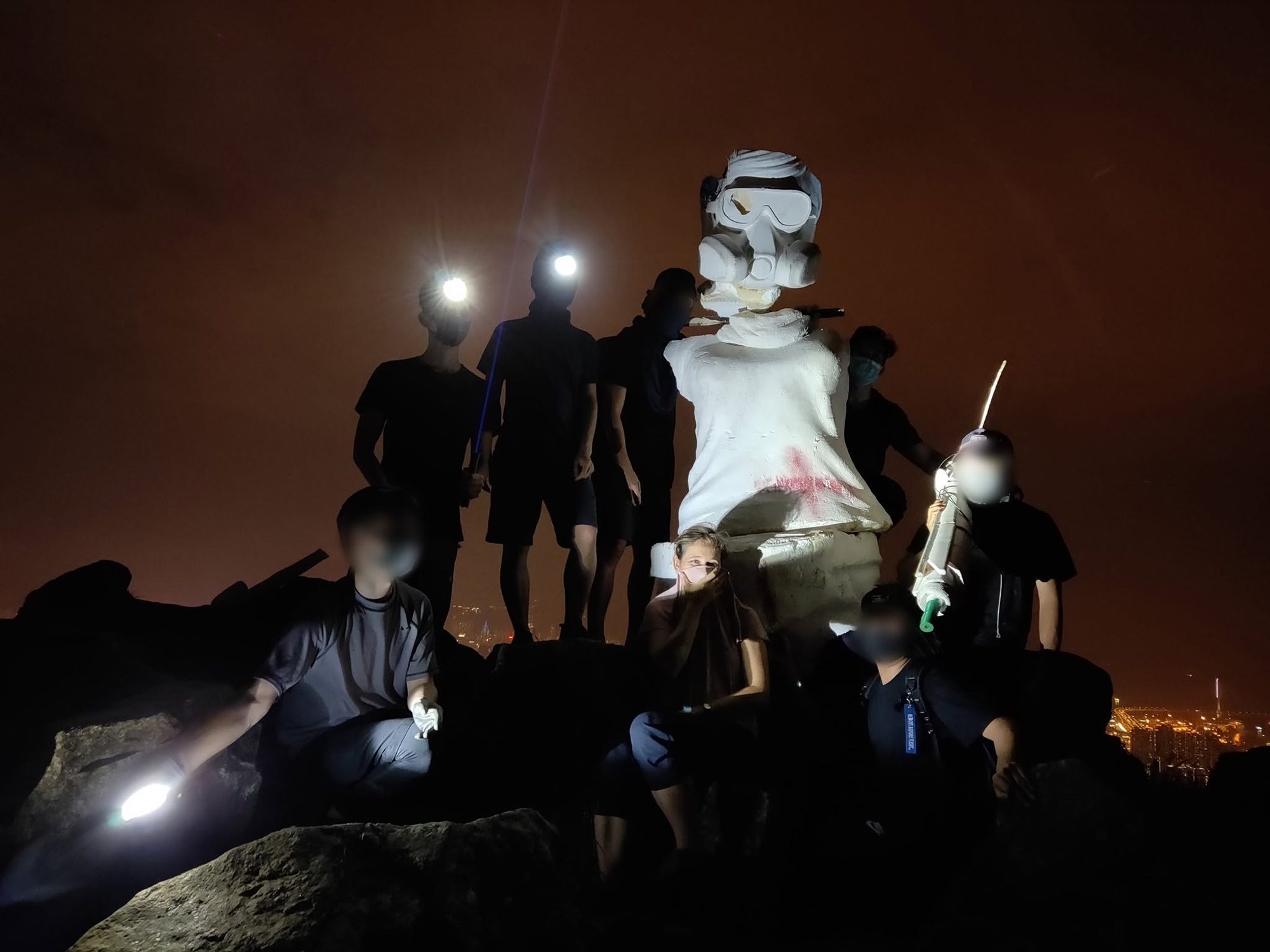 Lady Liberty HK Team Climbs Lion Rock in the Dead of Night to Recover the Statue's Remains